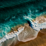 aerial-view-of-the-waves-breaking-on-the-sandy-beach-drone-photography