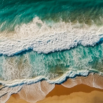 aerial-view-of-a-beautiful-sandy-beach-with-turquoise-ocean-waves-2