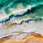 aerial-view-of-the-ocean-waves-breaking-on-the-sandy-beach
