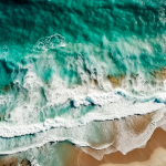 aerial-view-of-a-sandy-beach-and-ocean-waves-seascape-from-drone