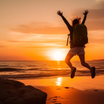 happy-man-jumping-on-the-beach-at-sunset-freedom-and-happiness-concept