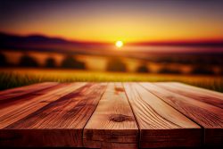 a-wooden-table-top-planks-product-display-with-a-blurred-background-scene-of-farmland-at-sunset-2