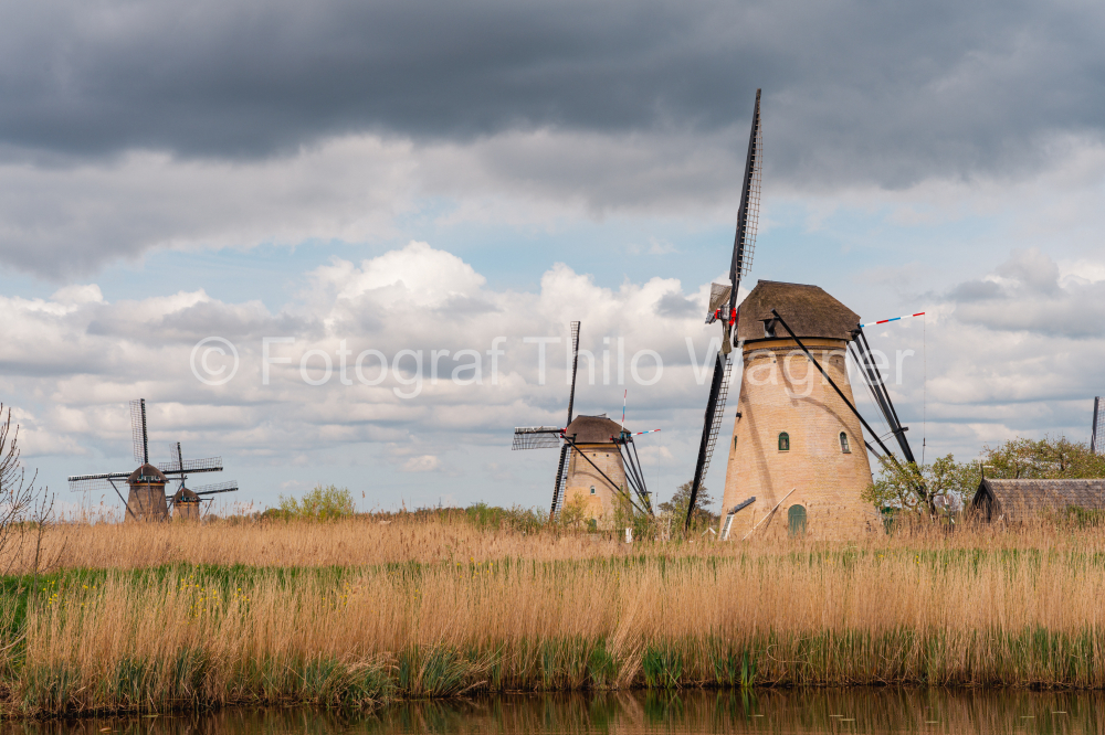 Windmills in Kinderdijk, Netherlands with stormy clouds