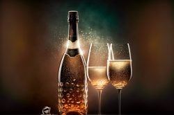 glasses-with-champagne-bottle-in-front-of-light-play-5