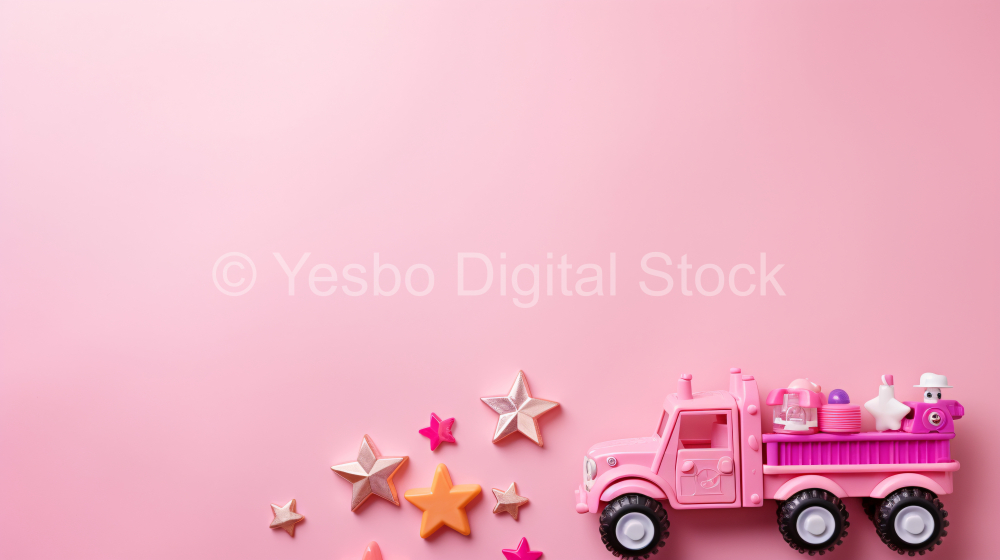 Truck with baby toys on pink background. Top view with copy space