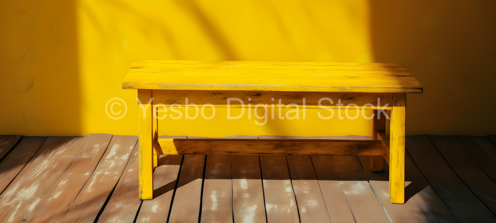 Wooden table with yellow wall and floor in the background